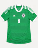 Front of Germany 2012-13 away kit, green adidas shirt, Mesut Ozil vintage football shirt, size M, flat lay