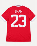 Back of Manchester United 2015-16 home kit with Luke Shaw name and number, vintage football shirt, size L, flat lay