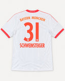 Back of Bayern Munich 2012-13 away kit with Bastian Schweinsteiger name and number, vintage football shirt, size L, flat lay