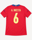 Back of Spain 2012-13 home kit with Andres Iniesta name and number, vintage football shirt, size M, flat lay